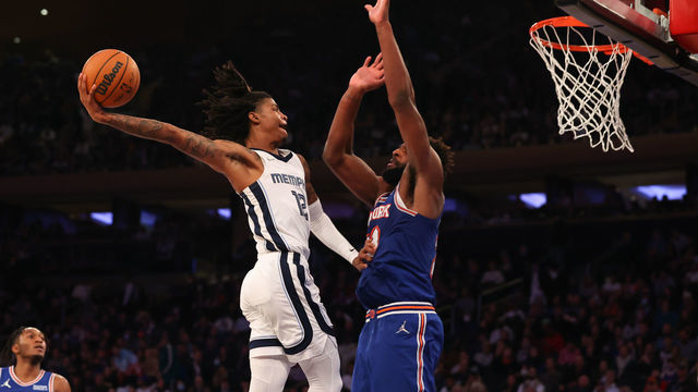 NEW YORK, NY - FEBRUARY 02: Ja Morant #12 of the Memphis Grizzlies drives against Mitchell Robinson #23 of the New York Knicks on February 2, 2022 at Madison Square Garden in New York City.