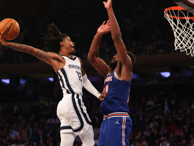 NEW YORK, NY - FEBRUARY 02: Ja Morant #12 of the Memphis Grizzlies drives against Mitchell Robinson #23 of the New York Knicks on February 2, 2022 at Madison Square Garden in New York City.