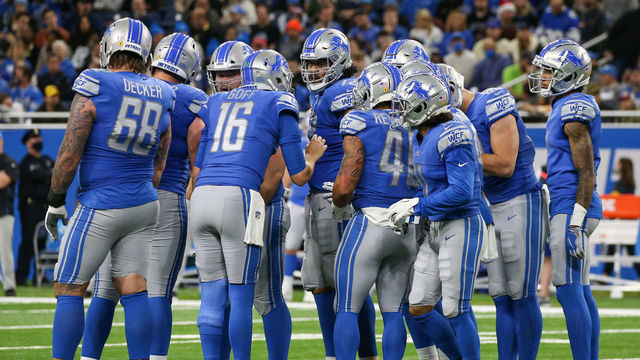 DETROIT, MI - DECEMBER 19: Detroit Lions quarterback Jared Goff (16) calls a play in the huddle during a regular season NFL football game between the Arizona Cardinals and the Detroit Lions on December 19, 2021 at Ford Field in Detroit, Michigan.