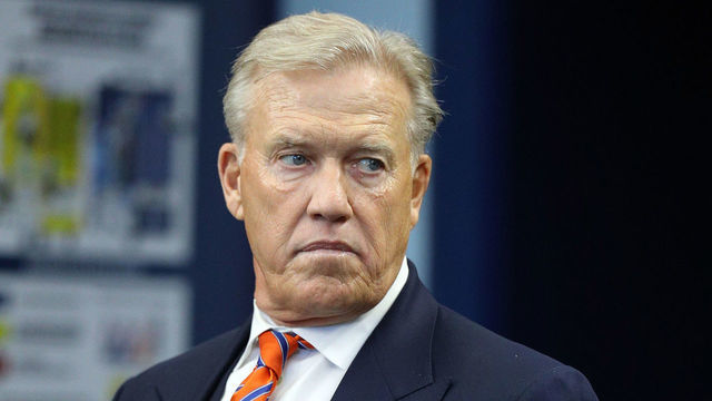 ARLINGTON, TEXAS - NOVEMBER 07: Denver Broncos president of Football Operations John Elway stands on the sidelines during the game against the Dallas Cowboys at AT&T Stadium on November 07, 2021 in Arlington, Texas.