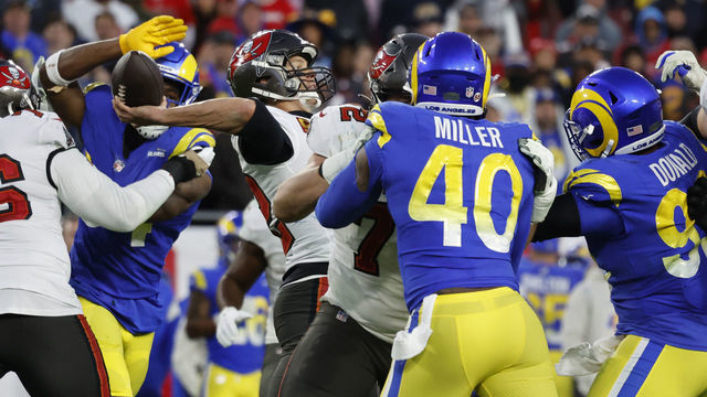 TAMPA BAY, FL- JANUARY 23, 2022: Tampa Bay Buccaneers quarterback Tom Brady (12) feels the pressure from Los Angeles Rams outside linebacker Leonard Floyd (54), Los Angeles Rams outside linebacker Von Miller (40) and Los Angeles Rams defensive end Aaron Donald (99) in the NFC Divisional game at Raymond James Stadium on January 23, 2022 in Tampa Bay, Florida.(Gina Ferazzi / Los Angeles Times via Getty Images)