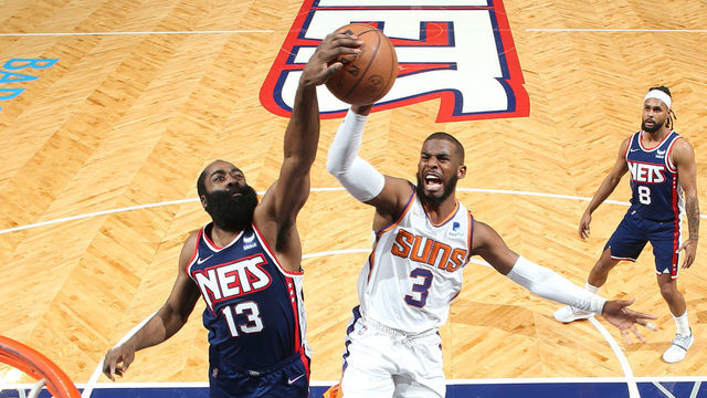 BROOKLYN, NY - NOVEMBER 27: James Harden #13 of the Brooklyn Nets blocks the shot of Chris Paul #3 of the Phoenix Suns during the game on November 27, 2021 at Barclays Center in Brooklyn, New York. Mandatory Copyright Notice: Copyright 2021 NBAE