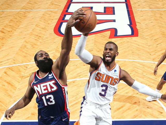 BROOKLYN, NY - NOVEMBER 27: James Harden #13 of the Brooklyn Nets blocks the shot of Chris Paul #3 of the Phoenix Suns during the game on November 27, 2021 at Barclays Center in Brooklyn, New York. Mandatory Copyright Notice: Copyright 2021 NBAE