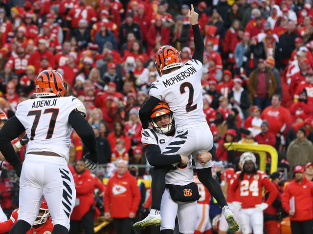 KANSAS CITY, MO - JANUARY 30: Cincinnati Bengals punter Kevin Huber (10) lifts kicker Evan McPherson (2) into air after making a game-winning 31-yard field goal in overtime of the AFC Championship game between the Cincinnati Bengals and Kansas City Chiefs on Jan 30, 2022 at GEHA Field at Arrowhead Stadium in Kansas City, MO.