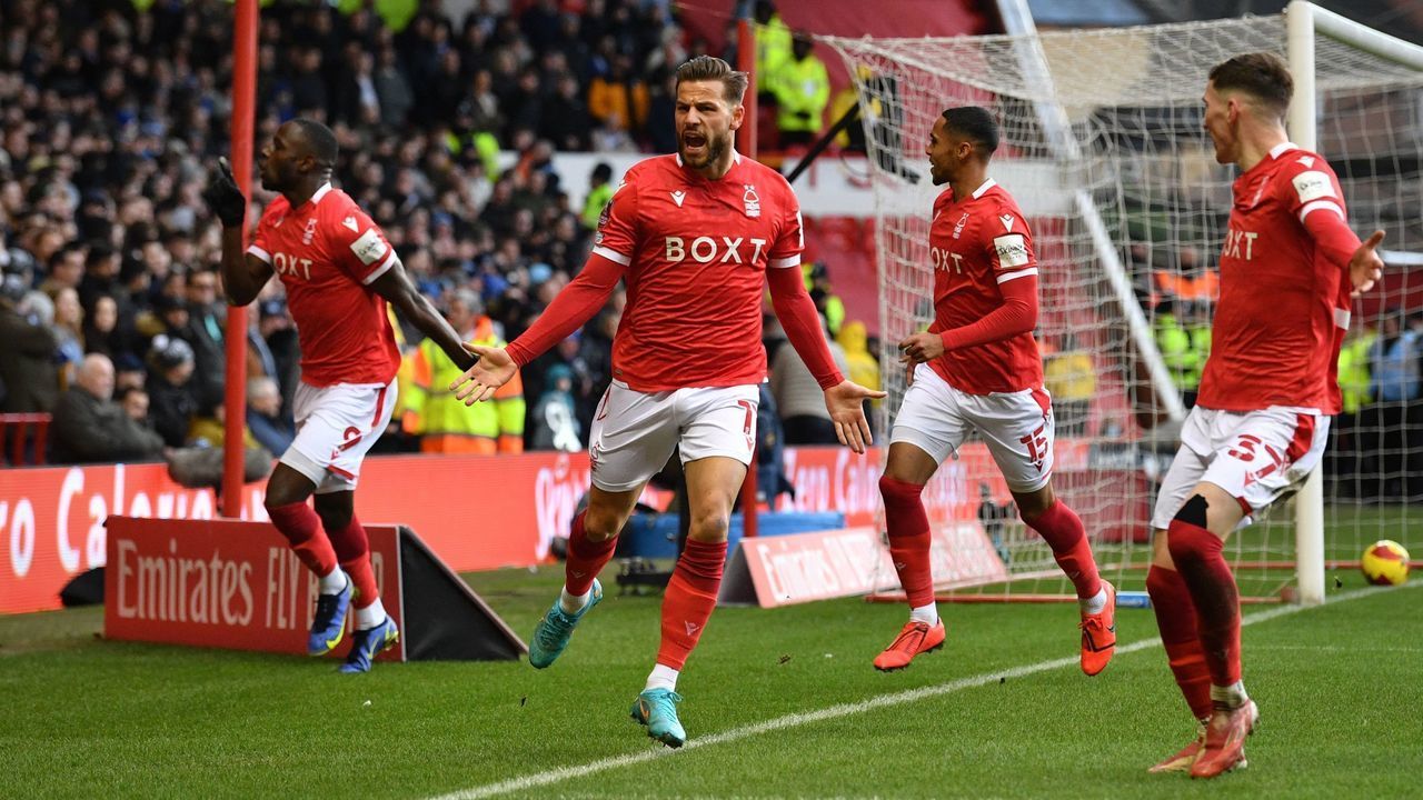 Nottingham Forest's Danish midfielder Philip Zinckernagel (2nd L) celebrates with teammates in front of the Leicester fans after scoring the opening goal of the English FA Cup fourth round football match between Nottingham Forest and Leicester City at The City Ground in Nottingham, central England, on February 6, 2022. - - RESTRICTED TO EDITORIAL USE. No use with unauthorized audio, video, data, fixture lists, club/league logos or 'live' services. Online in-match use limited to 120 images. An additional 40 images may be used in extra time. No video emulation. Social media in-match use limited to 120 images. An additional 40 images may be used in extra time. No use in betting publications, games or single club/league/player publications.