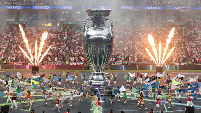 LONDON, ENGLAND - JULY 11: A general view inside the stadium as a large replica of The Henri Delaunay Trophy is seen whilst performers dance inside the stadium prior to the UEFA Euro 2020 Championship Final between Italy and England at Wembley Stadium on July 11, 2021 in London, England.