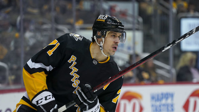 PITTSBURGH, PA - JANUARY 28: Pittsburgh Penguins Center Evgeni Malkin (71) looks on before the second period in the NHL game between the Pittsburgh Penguins and the Detroit Red Wings on January 28, 2022, at PPG Paints Arena in Pittsburgh, PA.