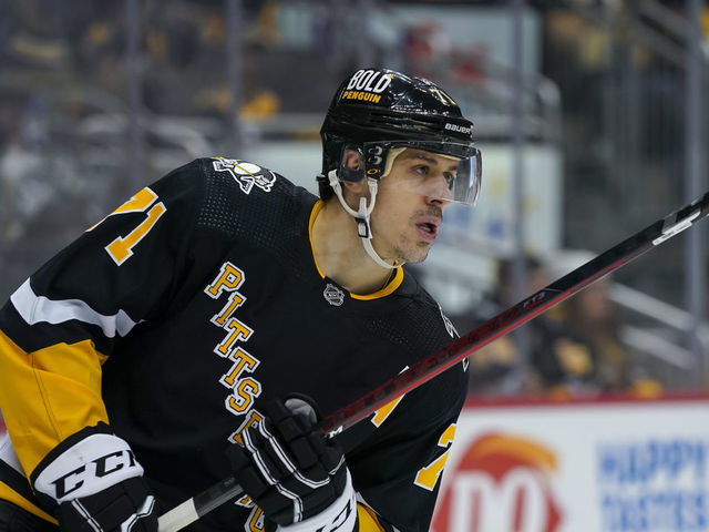 PITTSBURGH, PA - JANUARY 28: Pittsburgh Penguins Center Evgeni Malkin (71) looks on before the second period in the NHL game between the Pittsburgh Penguins and the Detroit Red Wings on January 28, 2022, at PPG Paints Arena in Pittsburgh, PA.
