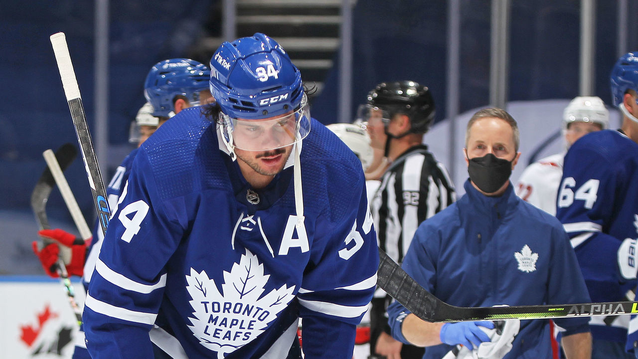 TORONTO, ON - FEBRUARY 7: Auston Matthews #34 of the Toronto Maple Leafs is injured late in the game against the Carolina Hurricanes during an NHL game at Scotiabank Arena on February 7, 2022 in Toronto, Ontario, Canada. The Maple Leafs defeated the Hurricanes 4-3 in overtime.