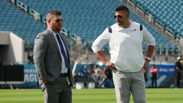 JACKSONVILLE, FLORIDA - OCTOBER 10: General Manager Jon Robinson and Head Coach Mike Vrabel of the Tennessee Titans watch warm ups prior to the game against the Jacksonville Jaguars at TIAA Bank Field on October 10, 2021 in Jacksonville, Florida.