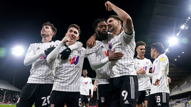 Fulham's Aleksandar Mitrovic (9) celebrates with Neco Williams (left), Harry Wilson (second left) and Nathaniel Chalobah after scoring their side's second goal of the game during the Sky Bet Championship match at Craven Cottage, London. Picture date: Tuesday February 8, 2022.