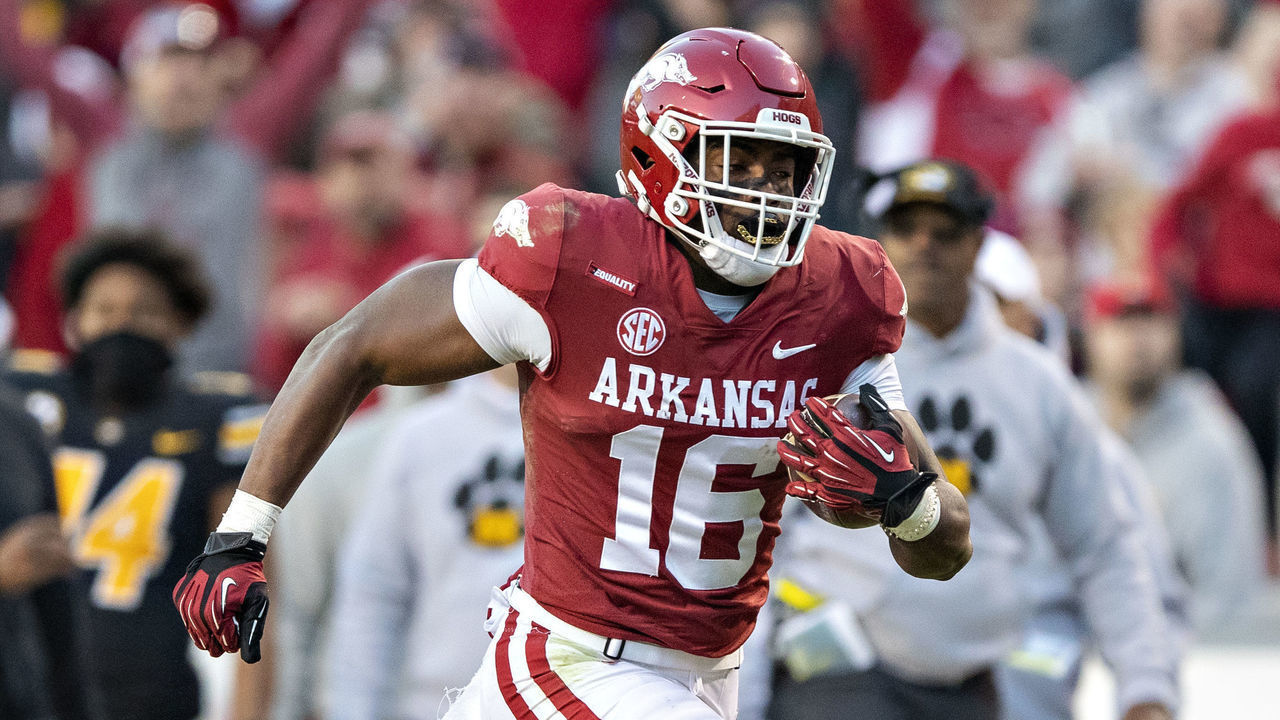 FAYETTEVILLE, ARKANSAS - NOVEMBER 26: Treylon Burks #16 of the Arkansas Razorbacks catches a pass for a touchdown during a game against the Missouri Tigers at Donald W. Reynolds Razorback Stadium on November 26, 2021 in Fayetteville, Arkansas. The Razorbacks defeated the Tigers 34-17.
