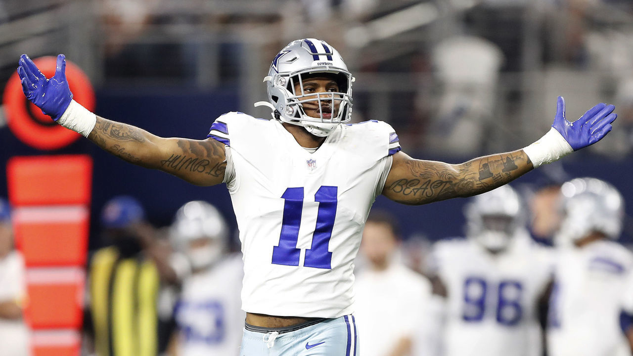 ARLINGTON, TEXAS - DECEMBER 26: Micah Parsons #11 of the Dallas Cowboys celebrates after a sack during the second half against the Washington Football Team at AT&T Stadium on December 26, 2021 in Arlington, Texas.