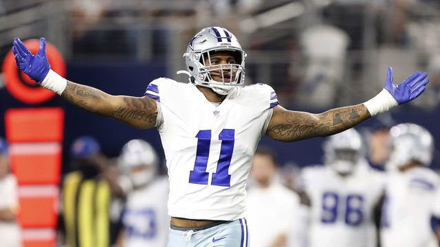 ARLINGTON, TEXAS - DECEMBER 26: Micah Parsons #11 of the Dallas Cowboys celebrates after a sack during the second half against the Washington Football Team at AT&T Stadium on December 26, 2021 in Arlington, Texas.