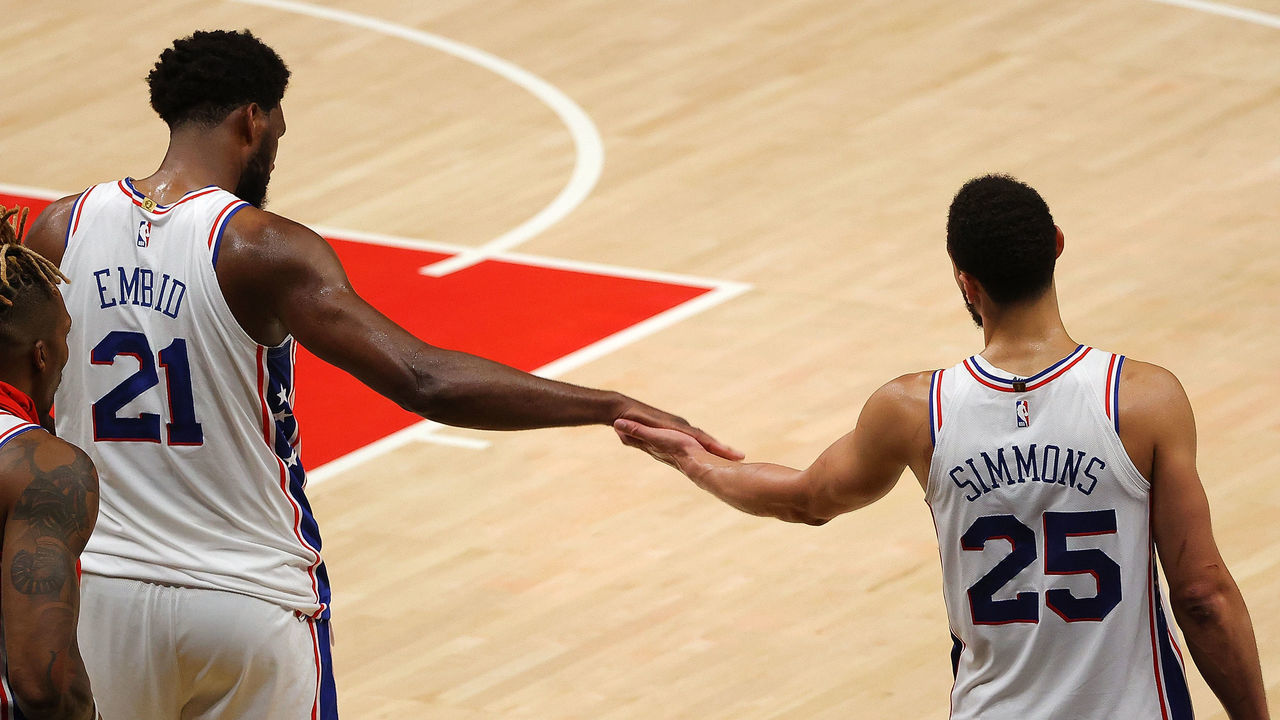 ATLANTA, GEORGIA - JUNE 11: Joel Embiid #21 and Ben Simmons #25 of the Philadelphia 76ers react in the final minutes of their 127-111 win over the Atlanta Hawks in game 3 of the Eastern Conference Semifinals at State Farm Arena on June 11, 2021 in Atlanta, Georgia.