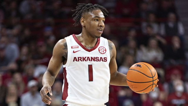 FAYETTEVILLE, ARKANSAS - FEBRUARY 05: JD Notae #1 of the Arkansas Razorbacks directs the offense during a game against the Mississippi State Bulldogs at Bud Walton Arena on February 05, 2022 in Fayetteville, Arkansas. The Razorbacks defeated the Bulldogs 63-55.