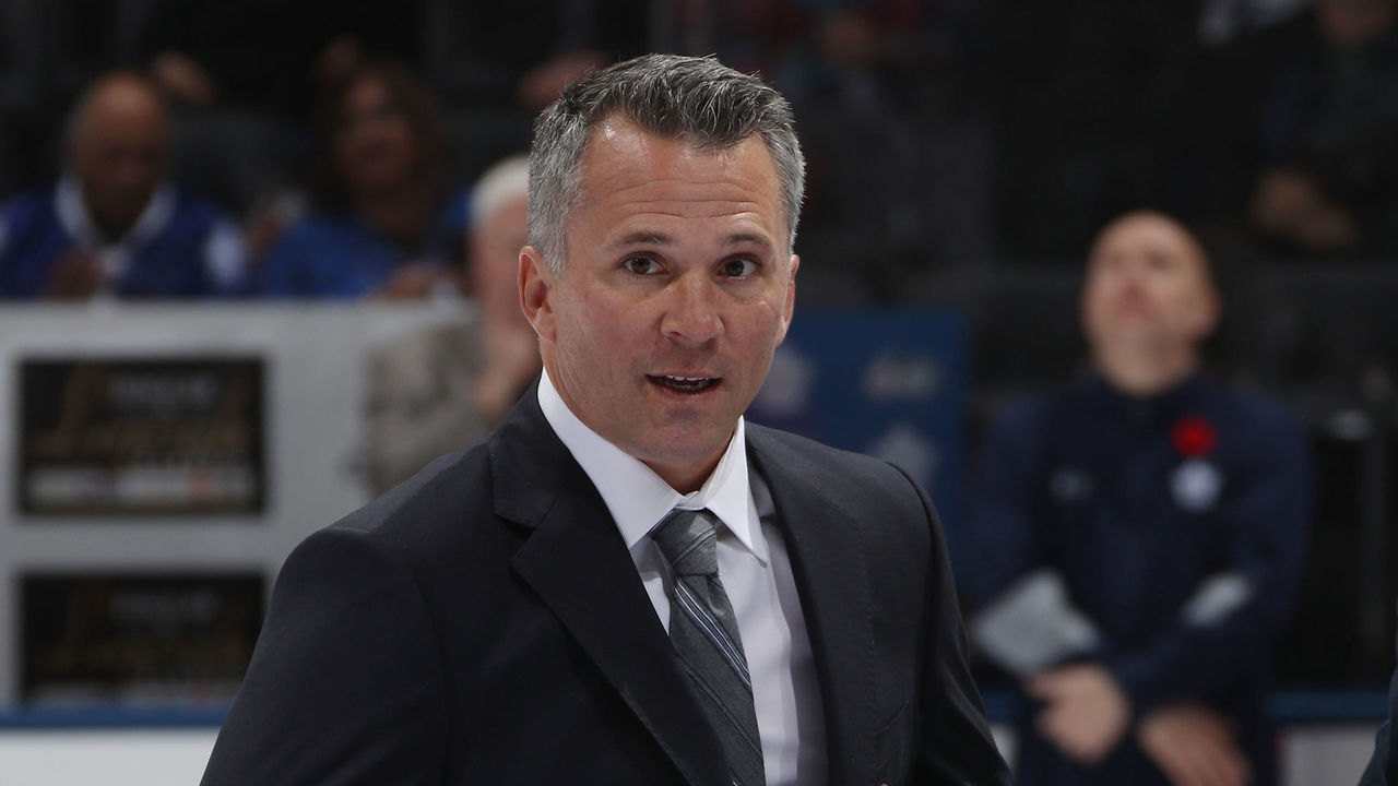 TORONTO, ONTARIO - NOVEMBER 11: Chairman of the Board of the Hockey Hall of Fame helps inductee Martin St. Louis put on the commemorative jacket prior to the 2018 Hockey Hall of Fame Legends Classic Game at the Scotiabank Place on November 11, 2018 in Toronto, Ontario, Canada.