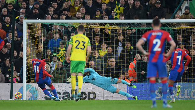 NORWICH, ENGLAND - FEBRUARY 09: Angus Gunn of Norwich City looks on as Wilfried Zaha of Crystal Palace misses a penalty during the Premier League match between Norwich City and Crystal Palace at Carrow Road on February 09, 2022 in Norwich, England.