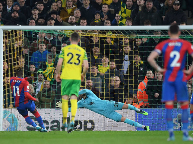 NORWICH, ENGLAND - FEBRUARY 09: Angus Gunn of Norwich City looks on as Wilfried Zaha of Crystal Palace misses a penalty during the Premier League match between Norwich City and Crystal Palace at Carrow Road on February 09, 2022 in Norwich, England.