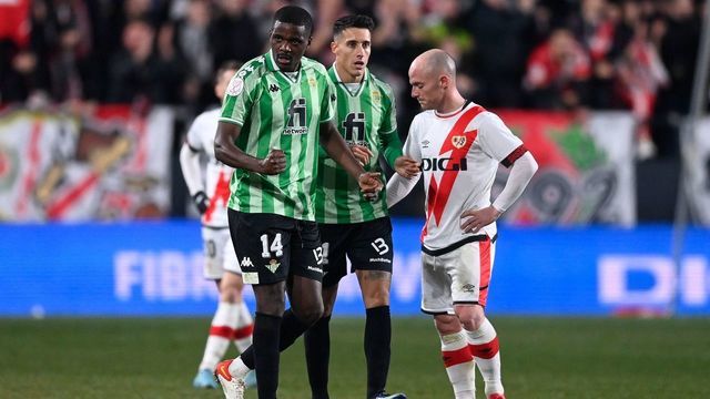 Real Betis' Portuguese midfielder William Carvalho (L) celebrates with teammates after scoring his team's second goal during the Spanish Copa del Rey (King's Cup) semi-final football match between Rayo Vallecano de Madrid and Real Betis at the Vallecas stadium in Madrid, on February 9, 2022.