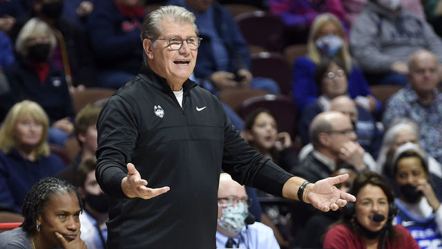UNCASVILLE, CONNECTICUT - DECEMBER 19: Head coach Geno Auriemma of the Connecticut Huskies watches the game against the Louisville Cardinals in the Basketball Hall of Fame Women's Showcase at Mohegan Sun Arena on December 19, 2021 in Uncasville, Connecticut.