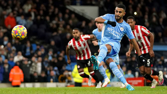 Manchester City's Riyad Mahrez scores their side's first goal of the game from the penalty spot during the Premier League match at the Etihad Stadium, Manchester. Picture date: Wednesday February 9, 2022.