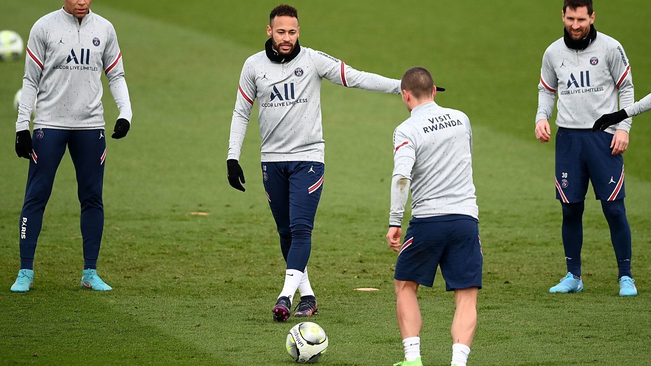 (FromL) Paris Saint-Germain's French forward Kylian Mbappe, Paris Saint-Germain's Brazilian forward Neymar and Paris Saint-Germain's Argentinian forward Lionel Messi eye the ball during a training session at the Camp des Loges Paris Saint-Germain football club's training ground, in Saint-Germain-en-Laye, west of Paris on February 10, 2022.