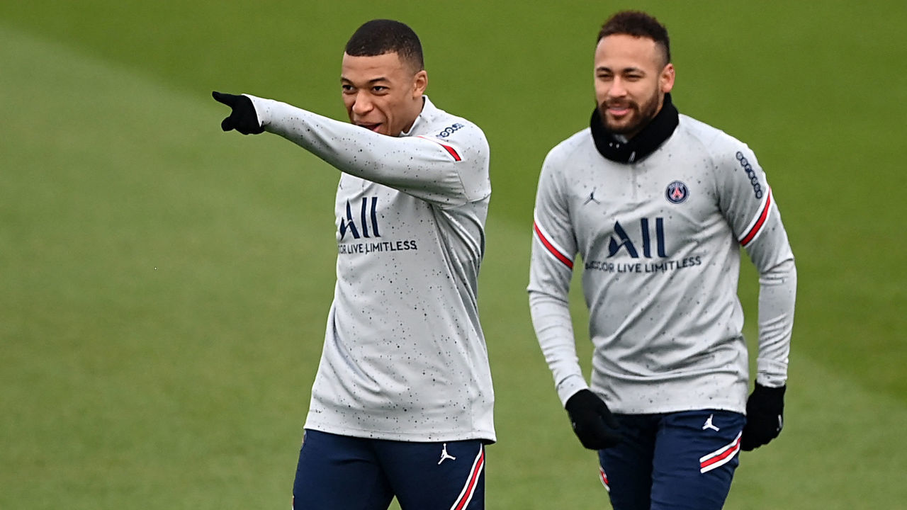 Paris Saint-Germain's French forward Kylian Mbappe (L) gestures past Paris Saint-Germain's Brazilian forward Neymar during a training session at the Camp des Loges Paris Saint-Germain football club's training ground, in Saint-Germain-en-Laye, west of Paris on February 10, 2022.