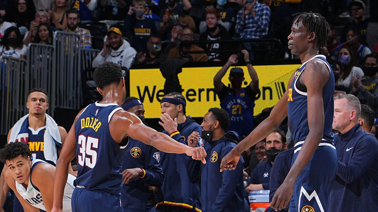 DENVER, CO - OCTOBER 29: P.J. Dozier #35 of the Denver Nuggets and Bol Bol #10 of the Denver Nuggets high-five during a game against the Dallas Mavericks on October 29, 2021 at the Ball Arena in Denver, Colorado. NOTE TO USER: User expressly acknowledges and agrees that, by downloading and/or using this Photograph, user is consenting to the terms and conditions of the Getty Images License Agreement. Mandatory Copyright Notice: Copyright 2021 NBAE