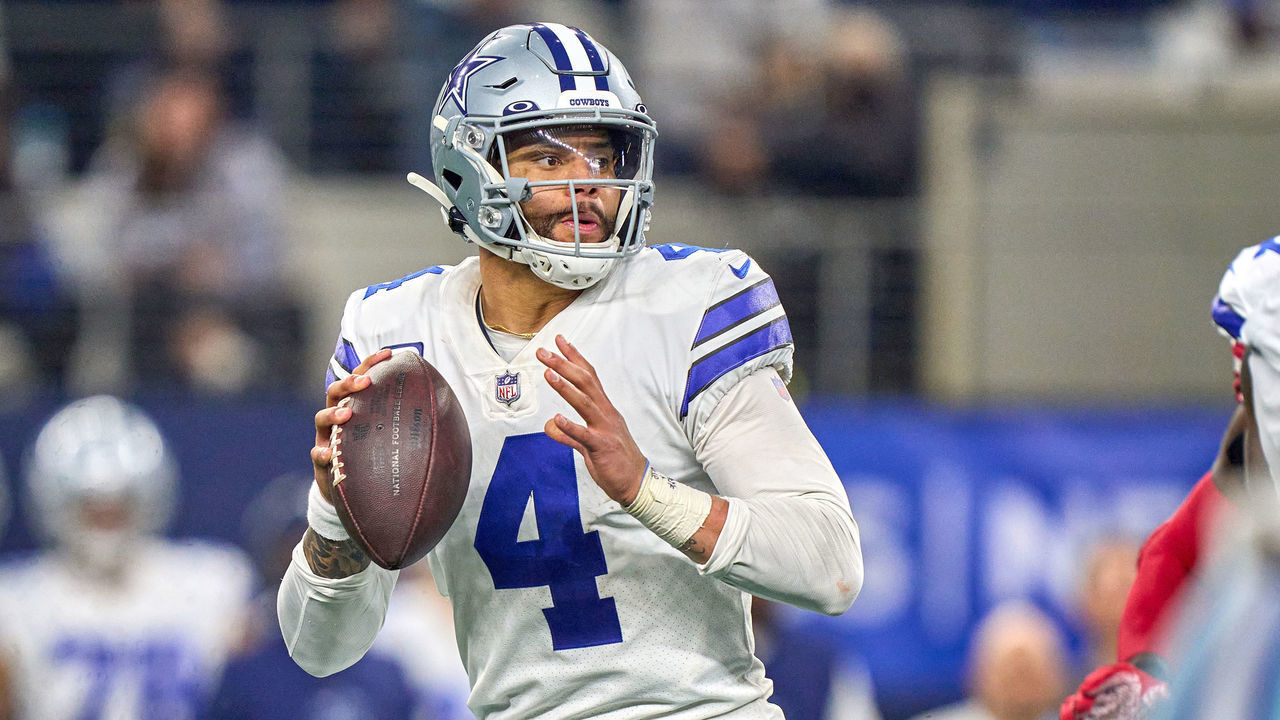 ARLINGTON, TX - JANUARY 16: Dallas Cowboys quarterback Dak Prescott (4) throws the football during the NFC Wild Card game between the San Francisco 49ers and the Dallas Cowboys on January 16, 2022 at AT&T Stadium in Arlington, TX.