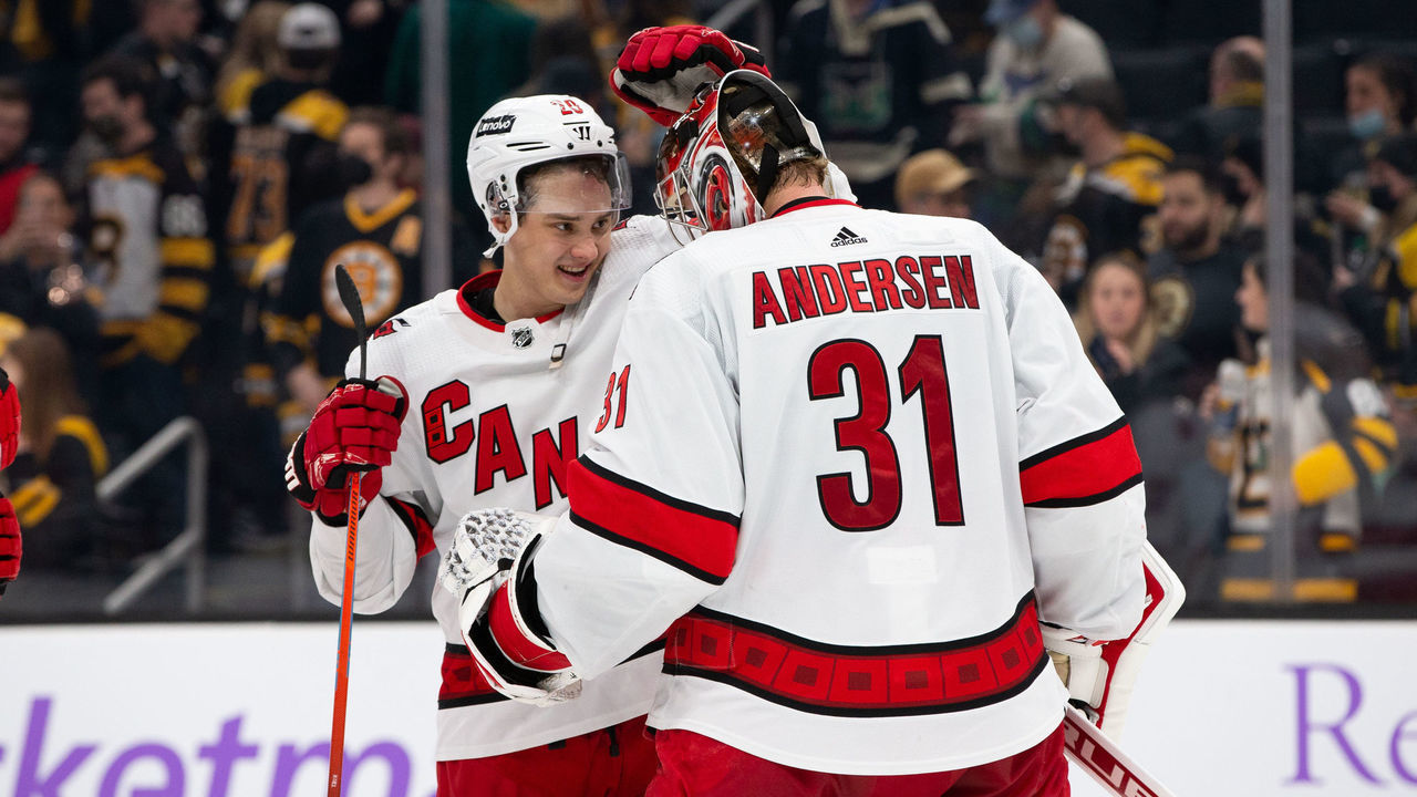 BOSTON, MA - FEBRUARY 10: Frederik Andersen #31 of the Carolina Hurricanes celebrates a 6-0 victory against the Boston Bruins with teammate Sebastian Aho #20 at the TD Garden on February 10, 2022 in Boston, Massachusetts.