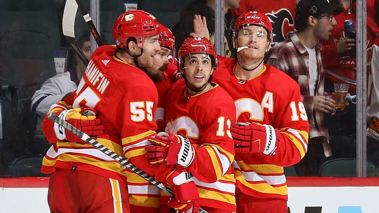 CALGARY, AB - FEBRUARY 10: Johnny Gaudreau #13 of the Calgary Flames celebrates with teammates after a goal against the Toronto Maple Leafs at Scotiabank Saddledome on February 10, 2022 in Calgary, Alberta, Canada.