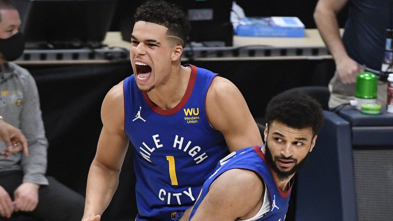 DENVER, CO - MARCH 19: Denver Nuggets guard Jamal Murray (27) runs past teammate Denver Nuggets forward Michael Porter Jr. (1) after sinking a three-point basket to send the game against the Chicago Bulls into overtime at Ball Arena March 19, 2021. Nuggets won 131-127. "n"n