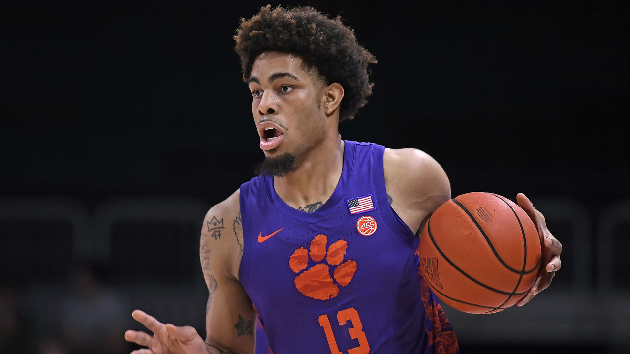 CORAL GABLES, FL - DECEMBER 04: Clemson guard David Collins (13) handles the ball in the first half as the University of Miami Hurricanes faced the Clemson University Tigers on December 4, 2021, at the Watsco Center in Coral Gables, Florida.