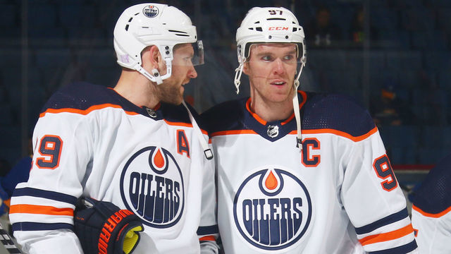 BUFFALO, NY - NOVEMBER 12: Leon Draisaitl #29 and Connor McDavid #97 of the Edmonton Oilers warmup prior to an NHL game against the Buffalo Sabres on November 12, 2021 at KeyBank Center in Buffalo, New York.