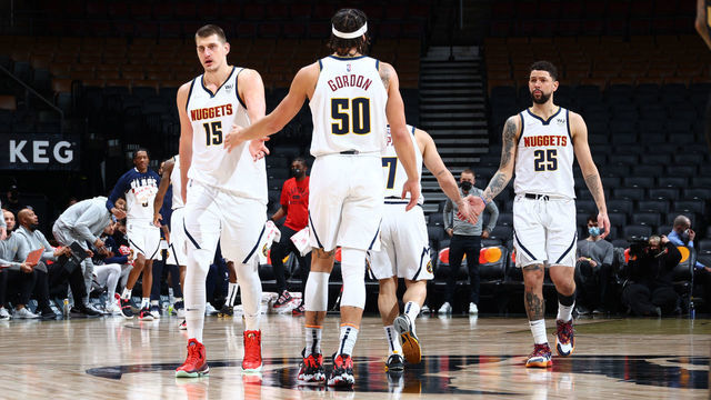 TORONTO, CANADA - FEBRUARY 12: Nikola Jokic #15 of the Denver Nuggets high fives Aaron Gordon #50 of the Denver Nuggets during the game against the Toronto Raptors on February 12, 2022 at the Scotiabank Arena in Toronto, Ontario, Canada. Mandatory Copyright Notice: Copyright 2022 NBAE