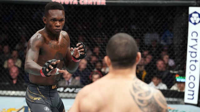 HOUSTON, TEXAS - FEBRUARY 12: (L-R) Israel Adesanya of Nigeria face Robert Whittaker of Australia in their UFC middleweight championship fight during the UFC 271 event at Toyota Center on February 12, 2022 in Houston, Texas.