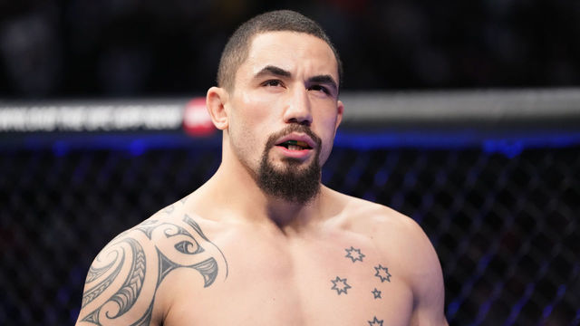HOUSTON, TEXAS - FEBRUARY 12: Robert Whittaker of Australia stands in his corner prior to facing Israel Adesanya of Nigeria in their UFC middleweight championship fight during the UFC 271 event at Toyota Center on February 12, 2022 in Houston, Texas.
