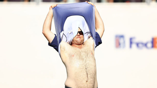 SCOTTSDALE, ARIZONA - FEBRUARY 13: Harry Higgs of the United States takes his shirt off on the 16th hole during the final round of the WM Phoenix Open at TPC Scottsdale on February 13, 2022 in Scottsdale, Arizona.