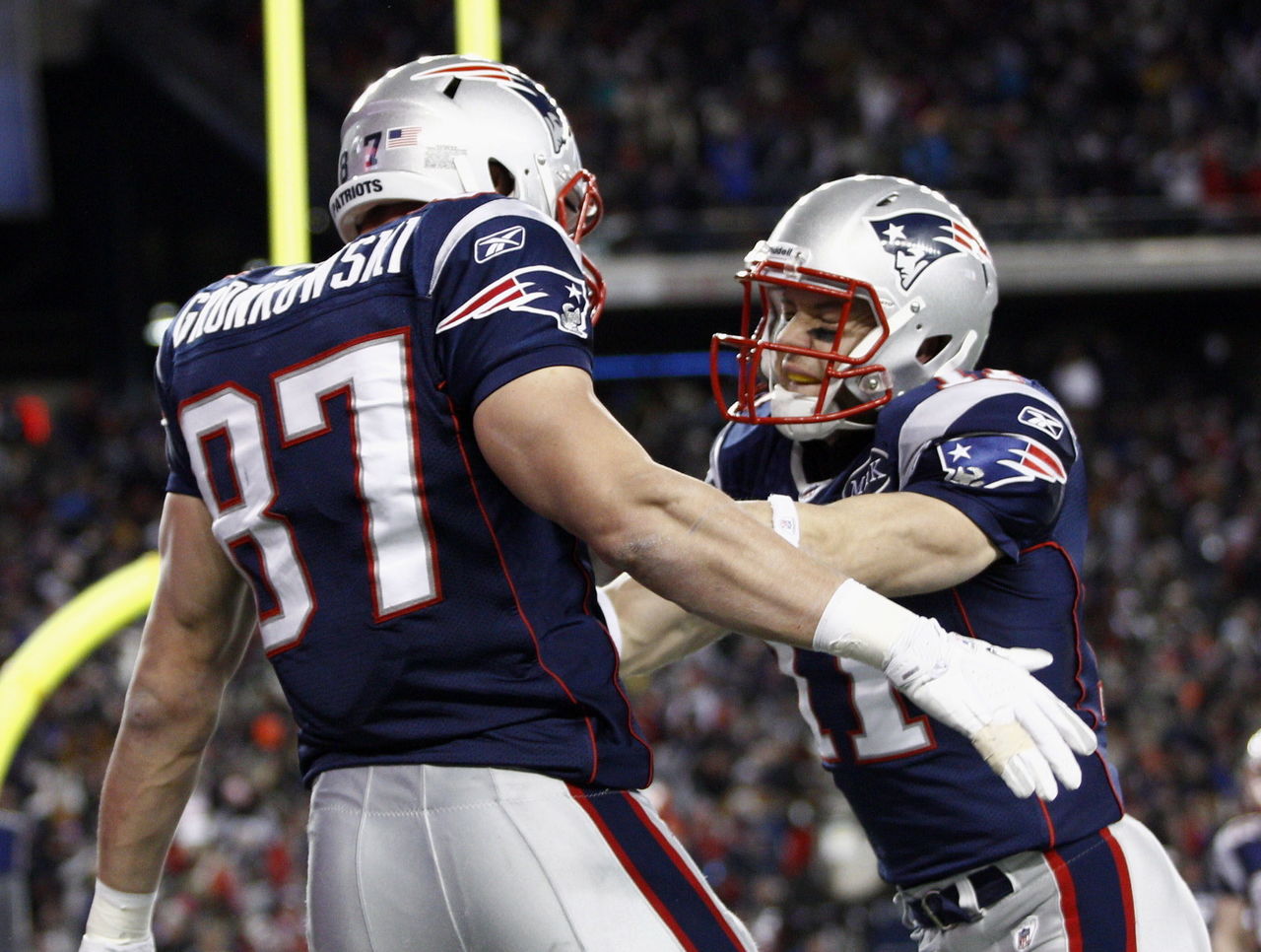 Rob Gronkowski wears a shirt of Julian Edelman wearing a Rob