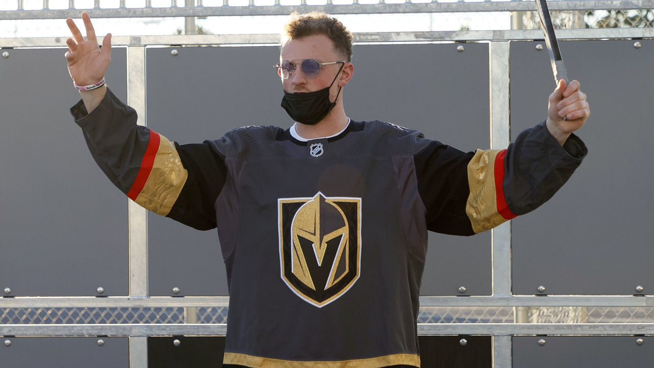 LAS VEGAS, NEVADA - NOVEMBER 08: Newly acquired Vegas Golden Knights player Jack Eichel celebrates a kid's goal as he participates in a youth clinic at a ball hockey rink at the Boys & Girls Clubs of Southern Nevada on November 8, 2021 in North Las Vegas, Nevada. The Golden Knights traded for Eichel and a conditional draft pick from the Buffalo Sabres in exchange for Alex Tuch, Peyton Krebs and two conditional draft picks on November 4. Eichel is expected to be available four months after undergoing an artificial disc replacement surgery in his neck.