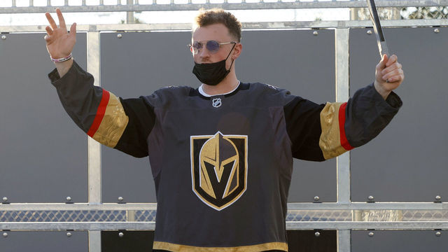 LAS VEGAS, NEVADA - NOVEMBER 08: Newly acquired Vegas Golden Knights player Jack Eichel celebrates a kid's goal as he participates in a youth clinic at a ball hockey rink at the Boys & Girls Clubs of Southern Nevada on November 8, 2021 in North Las Vegas, Nevada. The Golden Knights traded for Eichel and a conditional draft pick from the Buffalo Sabres in exchange for Alex Tuch, Peyton Krebs and two conditional draft picks on November 4. Eichel is expected to be available four months after undergoing an artificial disc replacement surgery in his neck.