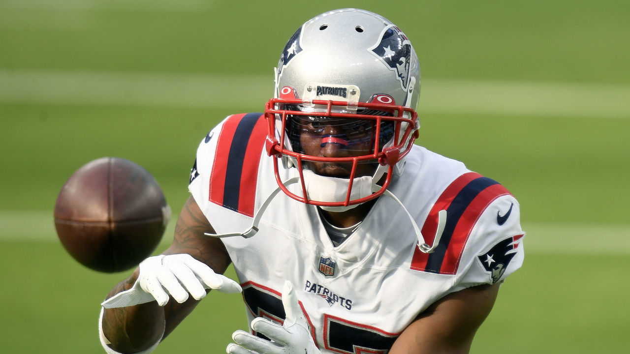 INGLEWOOD, CALIFORNIA - DECEMBER 06: J.C. Jackson #27 of the New England Patriots makes a catch during warm up before the game against the Los Angeles Chargers at SoFi Stadium on December 06, 2020 in Inglewood, California.