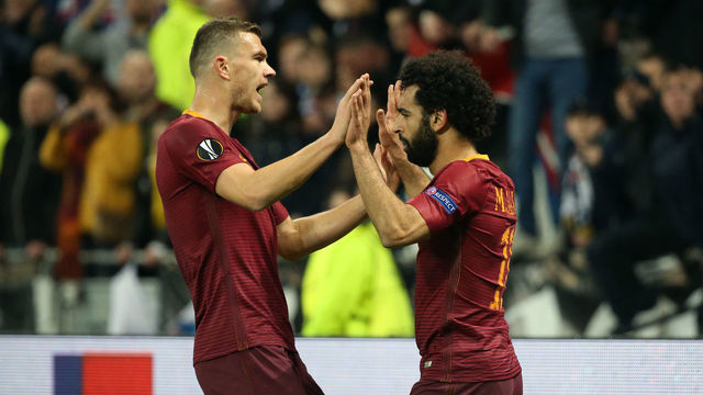 LYON, FRANCE - MARCH 9: Mohamed Salah of AS Roma celebrates his goal with Edin Dzeko (left) during the UEFA Europa League Round of 16 first leg match between Olympique Lyonnais (OL) and AS Roma at Parc OL on March 9, 2017 in Lyon, France.