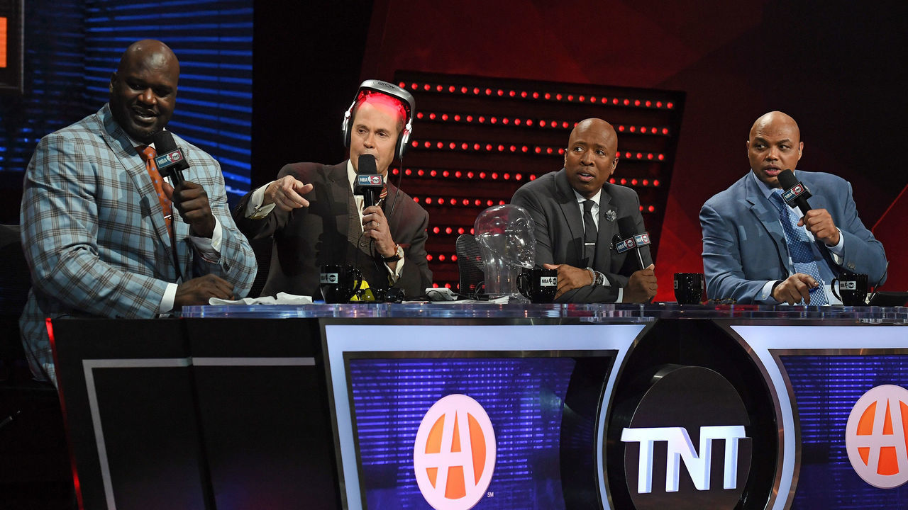 LAS VEGAS, NV - JANUARY 05: TNT's Inside the NBA team (L-R) NBA analyst Shaquille O'Neal, host Ernie Johnson Jr., wearing an iGrow laser-based hair-growth helmet, and NBA analysts Kenny Smith and Charles Barkley talk during a live telecast of "NBA on TNT" at CES 2017 at the Sands Expo and Convention Center on January 5, 2017 in Las Vegas, Nevada. CES, the world's largest annual consumer technology trade show, runs through January 8 and features 3,800 exhibitors showing off their latest products and services to more than 165,000 attendees.