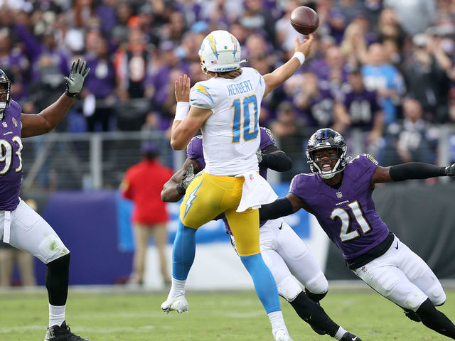 BALTIMORE, MARYLAND - OCTOBER 17: Defensive end Calais Campbell #93 and free safety Brandon Stephens #21 of the Baltimore Ravens pressure quarterback Justin Herbert #10 of the Los Angeles Chargers in the second half at M&T Bank Stadium on October 17, 2021 in Baltimore, Maryland.