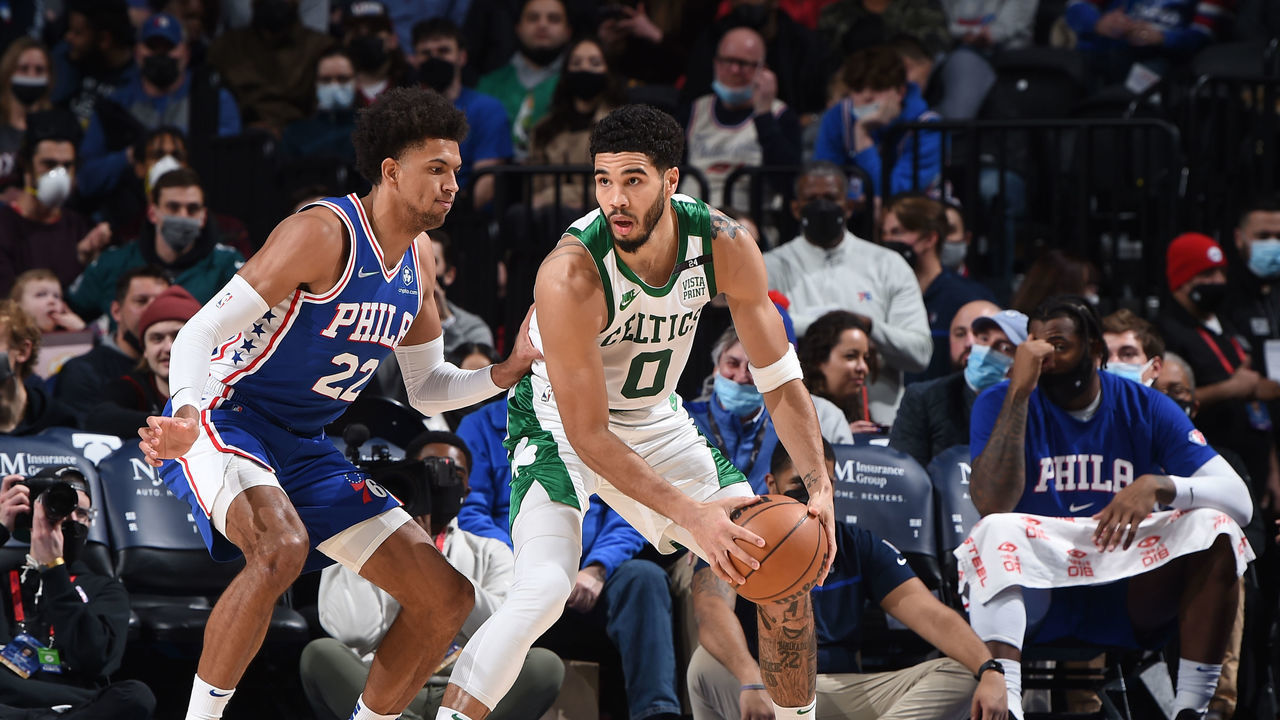 PHILADELPHIA, PA - JANUARY 14: Jayson Tatum #0 of the Boston Celtics handles the ball against Joel Embiid #21 of the Philadelphia 76ers on January 14, 2022 at Wells Fargo Center in Philadelphia, Pennsylvania. NOTE TO USER: User expressly acknowledges and agrees that, by downloading and/or using this Photograph, user is consenting to the terms and conditions of the Getty Images License Agreement. Mandatory Copyright Notice: Copyright 2021 NBAE