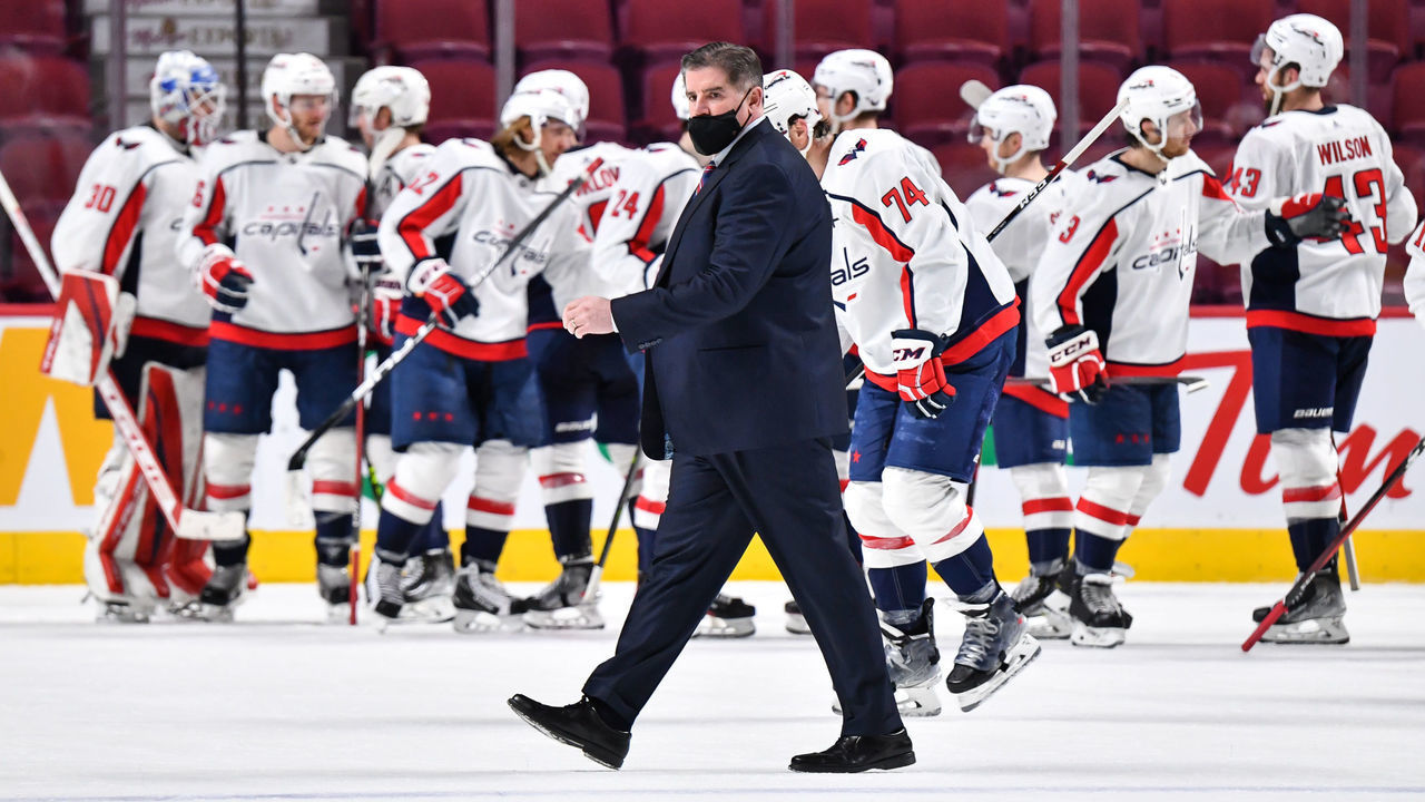 MONTREAL, QC - FEBRUARY 10: Head coach of the Washington Capitals Peter Laviolette walks across the ice as his team celebrates a victory against the Montreal Canadiens at Centre Bell on February 10, 2022 in Montreal, Canada. The Washington Capitals defeated the Montreal Canadiens 5-2.