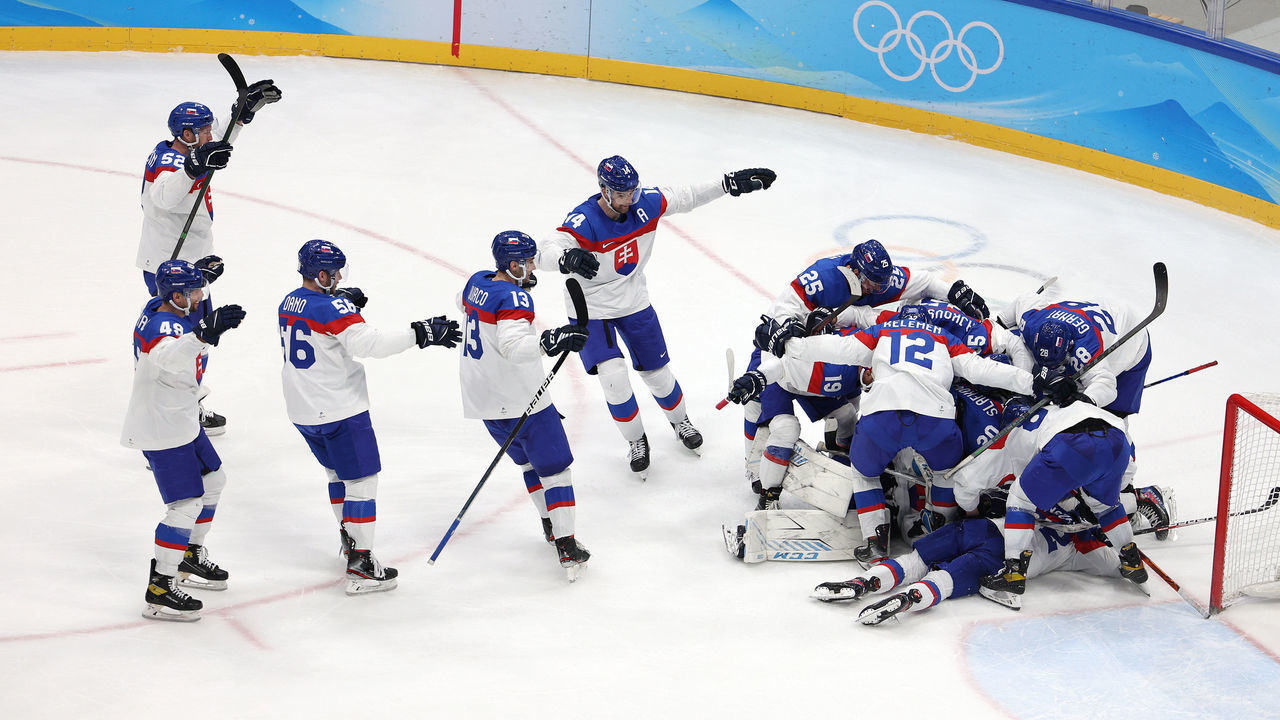BEIJING, CHINA - FEBRUARY 16: Team Slovakia celebrate with goaltender Patrik Rybar #24 at their net after their shootout win during the Men’s Ice Hockey Quarterfinal match between Team United States and Team Slovakia on Day 12 of the Beijing 2022 Winter Olympic Games at National Indoor Stadium on February 16, 2022 in Beijing, China.