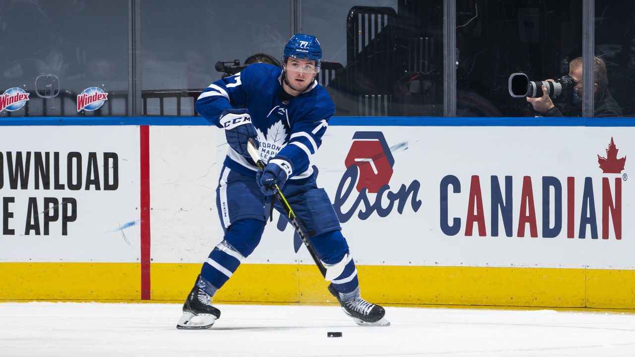 TORONTO, ON - JANUARY 22: Adam Brooks #77 of the Toronto Maple Leafs plays the puck against the Edmonton Oilers during the second period at the Scotiabank Arena on January 22, 2021 in Toronto, Ontario, Canada.